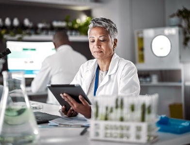 image of woman scientist using a tablet in a lab