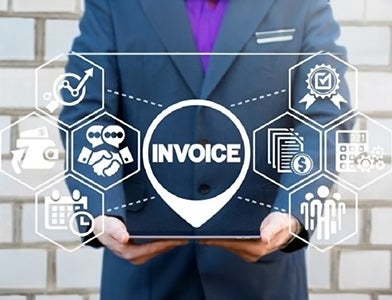 businessmean holding a graphic with the word "invoice"